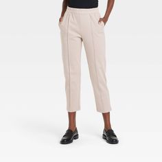 These High-Rise Tapered Ankle Knit Pull-On Pants from A New Day™ provide a polished look that blends comfort with elegance. These pull-on pants are made from a soft fabric blend with added spandex for comfortable wear that moves with you. Plus, they're tailored in a flattering high-rise, ankle-length silhouette and feature a tapered-leg cut for added flair. An elasticized waistband and slash pockets on the sides complete the design with functional flair. A New Day™: Style that goes wherever you Shipt Shopper, Pull On Pants, A New Day, Chinos Pants, Bottom Clothes, Polished Look, Ankle Length, Tapered Legs, Bottoms Pants