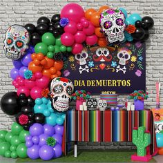 a party with balloons and skulls on the wall