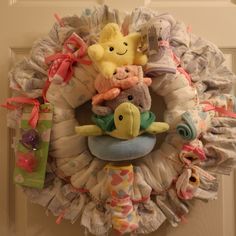 a wreath that has stuffed animals on it