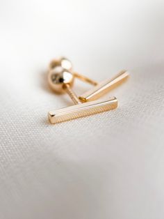 ✿ Tiny Modern Bar Gold Stud Earrings ✿ Made of 18k gold filled metal with screw on backs making them incredibly comfortable to wear.  Hypoallergenic, lead free, nickel free. Great for people with sensitive ears! Handmade in my home studio in Brookings, SD. Minimalist Screw-back Earrings As Gift, Minimalist Screw Back Earrings As Gift, Gold Bar Earrings Studs, Gold Bar Earrings, Bar Studs, Gold Stud Earrings, Modern Bar, Gold Filled Earrings, Bar Earrings