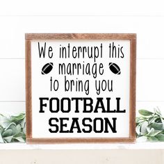 a framed sign that says we interrupted this marriage to bring you football season on it