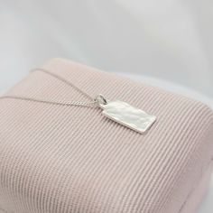 ~ PETITE note measurements  ~ .925 Sterling Silver TINY minimalist hand hammered rectangle bar pendant necklace ~ dainty, petite curb chain also solid .925 Sterling Silver   ~ small/dainty hand hammered pendant measures 10 mm x 6 mm x .80 mm thick Caring For Your  Jewelry Always remove your jewelry prior to bathing, swimming, sleeping, working out. Avoid contact with all chemicals including perfumes and lotions. Clean your jewelry with a jewelry polishing cloth. Store your clean, dry jewelry in Simple Sterling Silver Necklace With Rectangular Pendant, Minimalist Jewelry With Delicate Chain And Rectangular Pendant, Sterling Silver Hammered Rectangular Pendant Jewelry, Hammered Sterling Silver Rectangular Pendant Jewelry, Hammered Sterling Silver Jewelry With Rectangular Pendant, Sterling Silver Necklace With Rectangular Pendant, Hammered Sterling Silver Jewelry In Rectangular Shape, Sterling Silver Necklace With Rectangular Pendant For Her, Sterling Silver Rectangular Pendant Necklace As Gift For Her