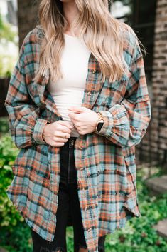 This Alyssa Plaid Flannel is a fall essential! This oversized flannel features distressing throughout, balloon sleeves, dainty buttons, and a collared neckline. Pair with black denim or leggings for a cozy fall look! The Fabric: 100% Cotton The Fit: Model is shown wearing size small Collared, button-up Raw hemming Sizing runs true. This flannel is an oversized fit. Measurements of garment: Small: Bust 42”| Waist 52”| Hips 52”| Front Length neck to hem 31”| Back Length neck to hem 33” Medium: Bus Fall Long Sleeve Flannel Shirt, Long Sleeve Flannel Shirt For Fall, Relaxed Fit Long Sleeve Flannel Shirt For Fall, Oversized Fall Flannel Shirt, Fall Button-up Flannel Shirt, Oversized Fall Flannel Shirt For Everyday, Oversized Flannel Shirt For Everyday Fall Wear, Oversized Long Sleeve Flannel Shirt For Fall, Distressed Button-up Tops For Fall