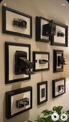 there are many pictures on the wall with cameras