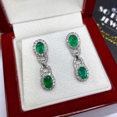 ONE OF A KIND HANDCRAFTED EARRINGS. IN STOCK! READY FOR SHIPPING! GIFT WRAP AVAILABLE! FREE UPS EXPRESS! STUNNING 2.80TCW, Certified Zambian Emerald earrings. UNIQUE DESIGN! ONE OF A KIND! TRANSPARENT, LARGE, SPARKLING EMERALDS IN PAIR! Extremely rare! Surrounded by TOP GRADE, F/VS DIAMONDS! Set in 18K solid white gold earrings. These earrings will absolutely dazzle anyone who sees them! Our jewelry are specially designed, and are delicately handcrafted by local, professional goldsmiths, who hav Gia Certified Formal Drop Earrings, Formal Platinum Earrings With Gemstone, Formal Platinum Gemstone Earrings, White Gold Drop Earrings With 17 Jewels, Hand Set Platinum Earrings For Anniversary, Formal Gia Certified Oval Earrings, Gia Certified Dangle Earrings For Formal Occasions, Gia Certified Dangle Earrings For Formal Events, Luxury Oval Gia Certified Earrings