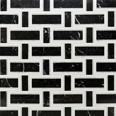 a black and white tile wall with some squares on the bottom, in different sizes