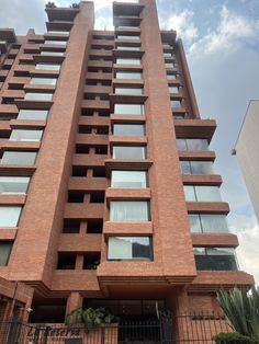 a tall brick building with lots of windows