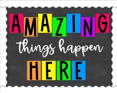 the words amazing things happen here written in multicolored blocks on a blackboard