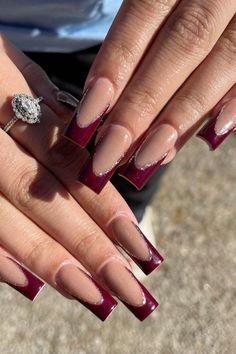 When it comes to burgundy chrome nails, there are so many design possibilities to choose from. Whether you prefer simple, elegant nails or something more detailed and artistic, the options are endless. Burgundy chrome gives off a high-shine, almost mirror-like effect that’s perfect for showcasing your nail art.  Some popular designs include adding intricate details like metallic stripes, tiny rhinestones, or subtle glitter accents. You can also try geometric patterns or mix in other colors like Dark Burgundy Acrylic Nails, Maroon Nail Tips, Maroon Coffin Nail Ideas, Maroon And Silver Nails Acrylic, Burgundy Birthday Nails, Black And Burgundy Nail Designs, Nails With Burgundy Dress, Burgundy Acrylic Nails Design, Burgundy French Tip Nails Acrylic