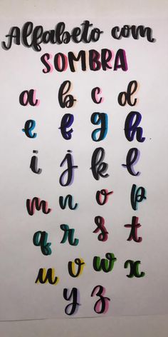 the letters and numbers are made out of colored paper with black marker writing on them