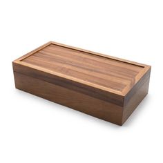 a large wooden box with a lid on the top and bottom, sitting on a white surface