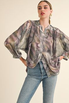 Description Product Details and Fit - V-neck- Button down- Collared- Long sleeves- Lantern sleeves- Flowy- Loose fit- Semi-sheer fabric Model Measurements - Model is wearing a size Small Fabric - 100% Polyester; Lining: 100% Rayon Style# JT2025B Sheer Button-up Top For Fall, Fall Sheer V-neck Blouse, Feminine V-neck Blouse With Button Closure, Billowy Feminine V-neck Top, Relaxed Fit V-neck Blouse With Blouson Sleeves, Billowy V-neck Top For Daywear, Relaxed Fit V-neck Blouse With Button Closure, Sheer V-neck Blouse For Daywear, Sheer V-neck Tops For Daywear