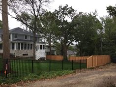 a black fence in front of a house