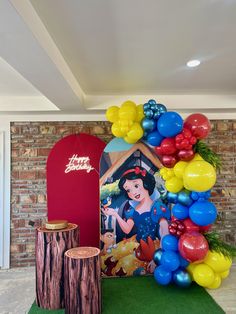 the balloon arch has been decorated with snow white and her friends, including princesses