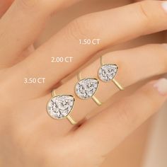 three pear shaped diamond engagement rings in yellow gold and white gold with measurements for each ring