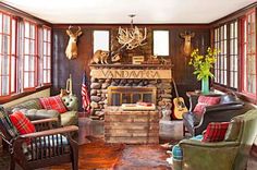 a living room filled with furniture and a fire place