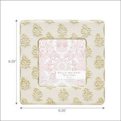 a white and gold photo frame with an ornate design on the front, measurements for each piece