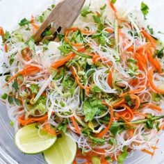 a salad with carrots, cabbage and cilantro