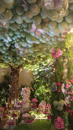 the ceiling is decorated with balloons and flowers