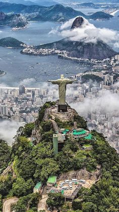 an aerial view of the statue of christ on top of a mountain in rio, brazil