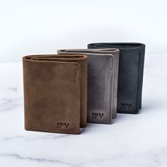 A trifold wallet  for the man that carries it all. Hold up to 12 cards (plus cash) in this distressed leather men’s wallet. ✔ DESIGNED TO LAST: Each leather trifold wallet is crafted from minimally processed cowhide that varies in grain pattern and markings-for crafts as unique as you.✔ 12 CARD CAPACITY: 6 card slots hold up to 12 cards comfortably.✔ ID CARD & CASH POCKET: Clear plastic sleeve for your ID Card and an ample cash pocket. ✔ PERSONALIZED WALLET: Make it yours with firebranded in Personalized Leather Notebook, Cash Wallet, Personalized Leather Wallet, Leather Trifold Wallet, Work Badge, Group Gifts, Personalized Wallet, Minimalist Gifts, Leather Notebook