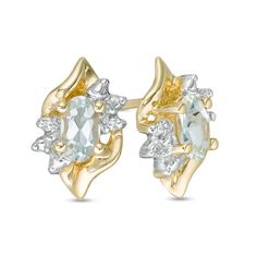 The perfect gift for her March birthday, these spirited gemstone stud earrings offer eye-catching style. Crafted in warm 10K gold, each lively earring showcases a 5.0 x 3.0mm oval-shaped icy-blue aquamarine wrapped in a sculpted flame-shaped frame. Sparkling diamond accents lend eye-catching shimmer to the look. Buffed to a brilliant luster, these post earrings secure comfortably with friction backs. Gemstone Stud Earrings, Aquamarine Stone, Gemstone Studs, Aquamarine Blue, Perfect Gift For Her, Sparkle Diamonds, Diamond Stone, 10k Gold, Blue Stone