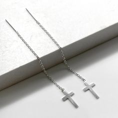 One pair of high quality sterling silver Cross threader earrings. Lightweight and easy to wear, from day to night - they are effortlessly stylish, giving you a up to date and feminine look. Simple yet striking, these fine chain Threader Earrings look stunning on. Just push in and gently pull through. Threader earrings are worn with part of the chain hanging behind the earlobe and the remainder hanging in front. The ultimate in minimalist earrings 💕Details Cross: 7 mm wide Length: approx 60 mm 💕 Online store: www.thejewellerytree.net 💕 Stay up-to-date with new designs & special offers  - FOLLOW ME   Socials: @myjewellerytree OR  https://www.facebook.com/thejewellerytree1/  💕 Need more info, feel free to email - I'd love to help 💕And please visit my store https://www.etsy.com/au/shop/Th Minimalist Sterling Silver Threader Earrings For Gift, Simple Silver Threader Earrings As Gift, Minimalist Sterling Silver Linear Earrings For Gift, Minimalist Sterling Silver Linear Earrings As Gift, Hypoallergenic Sterling Silver Threader Earrings As Gift, Classic Silver Threader Earrings As Gift, Minimalist Silver Linear Earrings For Pierced Ears, Minimalist Silver Linear Earrings For Gift, Silver Minimalist Linear Pierced Earrings