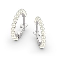 Take your look to the next level with these gleaming pearl hoop earrings. Fashioned in sterling silver, each opulent earring showcases a row of lustrous 3mm ball-shaped cultured pearls curving around the entire hoop to ensure shimmer from every angle. Polished to a bright shine, these earrings secure with latch backs.Carat Weight: 6.5 ctStone Size: 3 mmStone Type: Jeulia® StoneNumber of Stones: 26 Stone Color: Diamond WhiteStone Shape: RoundWeight: 3.63 gWidth: 2.9 mmHeight: 2.1 mmThickness: 3.7 Classic Pearl Hoop Huggie Earrings, Formal Hoop Earrings With Pearl Charm, Formal Pearl Drop Hoop Earrings, Classic Pearl Huggie Earrings Small Hoop, Classic Pearl Small Hoop Huggie Earrings, Classic Pearl Hoop Earrings, Classic Small Hoop Pearl Huggie Earrings, Classic Small Hoop Hypoallergenic Pearl Earrings, Classic Hypoallergenic Small Hoop Pearl Earrings