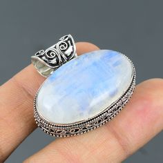 Note: Due to the natural formation of this gemstone. Slight variation in design and color are to be expected. Rainbow Moonstone Pendant 925 Sterling Silver Pendant Handmade Ethnic Jewelry Real Gemstone Pendant Anniversary Gift For Mom Vintage Pendant SKU  : VP-312 Handmade Pendant Gemstone :  Rainbow Moonstone Stone Shape : Oval Metal Purity : 925 Sterling Silver Pendant Length : 33 MM Pendant Width : 38 MM Rainbow moonstone is thought to bring balance, harmony and hope while enhancing creativit Bohemian Moonstone Cabochon Jewelry, Handmade White Moonstone Gemstones, Natural Silver Moonstone Gemstones, Bohemian White Oval Jewelry, Bohemian Sterling Silver Gemstones, Silver Moonstone Gemstones For Healing, Bohemian Oval Moonstone Jewelry, Bohemian Moonstone Gemstone Jewelry, Handmade Silver Moonstone Gemstones