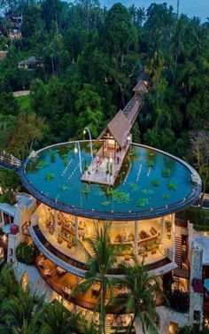 an aerial view of the pool and restaurant at night