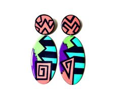 "Looking for a vibrant pair of handmade statement earrings to add to your collection? Look no further. The sharp geometric shapes and bold colors will certainly turn heads. As always, each pair is extremely lightweight, easy to wear, and made to order! Please allow 3-4 days for processing.  Dimensions: H: 4.5\" W: 1.75\" Care Notes  Avoid extreme moisture  Store in a dry place  Do not bend" African Earrings, Oval Earrings, Artisan Earrings, Handcrafted Accessories, Oval Earring, African Jewelry, Colorful Earrings, Geometric Designs, Abstract Shapes