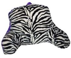 a zebra print pillow is shown on a white background and purple trimmings are visible