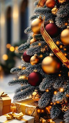 a christmas tree with gold and red ornaments