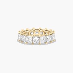 This timeless eternity ring features the boldness and intense sparkle of princess cut diamonds. A classic, tailored shared prongs setting allows the maximum amount of the diamonds surface to show. *Number of diamonds and carat total weight will vary depending on ring size. Yellow Sapphire Rings, Green Emerald Ring, Princess Cut Gold, Diamond Eternity Ring, Rings Mens Wedding Bands, Platinum Wedding Rings, Classic Wedding Rings, Cushion Cut Ring, Pink Sapphire Ring