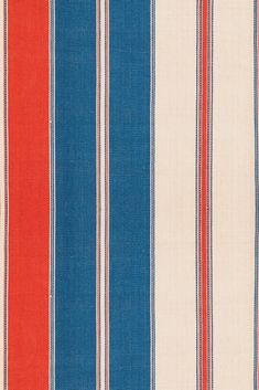 an orange, blue and white striped fabric with red stripes on the bottom half of it