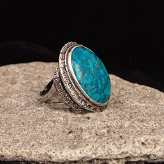 "Do you want to emphasize the bright individuality? This ring in Bohemian design is the best way to do it. This jewelry will make an accent in your summer look. This precious ring made by the author's design and limited edition. Silver ring is inlaid with large natural Eilat chrysocolla stone. Chrysocolla is a stone of balanced communication, allowing for self expression and refrain. This green-blue gemstone links to spirit communication. Only in our store you are guaranteed to buy silver jewelr Round Turquoise Ring With Stone Setting As Gift, Oval Turquoise Ring With Stone Setting Gift, Oval Turquoise Ring With Stone Setting, Spiritual Oval Gemstone Engraved Ring, Spiritual Oval Engraved Ring With Gemstone, Spiritual Oval Engraved Gemstone Ring, Spiritual Turquoise Open Ring For Gift, Turquoise Open Ring With Large Stone For Gift, Unique Turquoise Oval Cabochon Ring As Gift