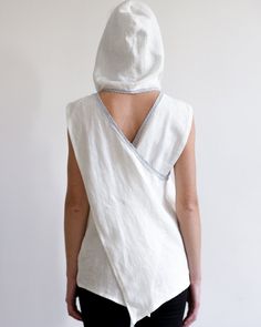 "Linen top with roomy hood and pockets. Loose shape and interesting cut. Perfect choice for hot summer days! The hood can be raised in wind or to protect against the sun, but can also be neatly draped on the shoulders to create another fresh look. Model is wearing size M blouse in creamy white. Each piece is individually cut, sawn and pre-washed. We really love making various sizes - from petit to plus size and more. For the best fitting of this shirt please let us know the following measurement Relaxed Fit Hooded Beach Tops, Relaxed Fit Hooded Tops For Beach, White Drawstring Hood Top For Summer, White Drawstring Hooded Top For Summer, White Summer Top With Drawstring Hood, White Hooded Tops For Summer, Summer Hooded Tops With Pockets, Hooded Summer Top With Pockets, Hooded Beach Tops For Spring