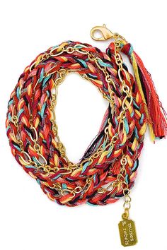 A satin gold plated link chain woven into a 100% cotton & metallic polyester thread braid with thread tassels at each end. The braid colors are red, maroon, rust, mauve, corn, aqua, black & multi metallic. The closure is a satin gold-plated trigger clasp. The total length of the chain is 28.5" (including 2 1/4" extension for size adjustability). This style can be worn as a wrap bracelet, necklace or anklet. The chain wraps approximately 4 times around the wrist (depending on wrist size). Red Braided Bohemian Jewelry, Gold Woven Braided Bracelets For Festival, Braid With Thread, Braid Colors, Fringe Bracelet, Thread Tassels, Los Angeles Design, Hand Screen Printed, Red Maroon