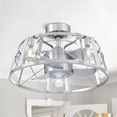 a light fixture in a room with white walls