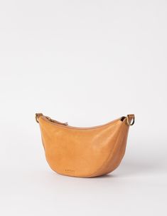 Say hello to Leo, the slouchy leather bag that fits all that you need for a busy day in town. Think of Leo as the cool sibling of our more structured Laura bag. Leo can be worn across the body as a bum bag, or on the shoulder as chic arm candy. Leo is unisex, catering to everyone who embraces that bumbag style. Leo comes in our wild oak soft grain leather, that timeless addition to any outfit. Do you want to wear Leo as a longer cross-body bag? Make sure to also add this strap to your cart. OMB- On-the-go Tan Shoulder Bag, On-the-go Soft Leather Crossbody Shoulder Bag, On-the-go Suede Shoulder Bag With Suede Lining, Yellow Soft Leather Bag For On-the-go, On-the-go Suede Shoulder Bag With Adjustable Strap, Style Rules, Sustainable Leather, Antique Brass Hardware, Cross Body