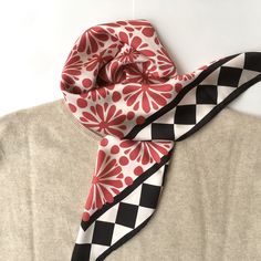 Square satin scarf with red flowers and black squares. An eye catching accessory for multiple uses; as a scarf, or head cover like hijab or handbag accessory. The print is designed by me. Lenght 64 cm, wide 64 cm. For shoppers in United States and Canada: https://www.etsy.com/listing/986269692 Other scarves in my shop: https://www.etsy.com/shop/wegowild Each item will be wrapped in attractive wrapping paper and carefully send. It is ready for gift giving. If you have special wishes, please let me know.  You can follow me on Instagram and Pinterest: Pinterest: https://nl.pinterest.com/miracola2758 Instagram: @miracolabottega Elegant Red Square Silk Scarf, Red Scarves For Spring Gifts, Red Scarves As Spring Gifts, Red Scarf As A Spring Gift, Red Scarf For Spring Gift, Trendy Red Silk Scarf For Spring, Elegant Red Square Scarf, Red Square Silk Scarf For Gifts, Trendy Red Scarves As A Gift