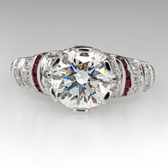 This beautiful contemporary Art Deco style platinum diamond and ruby accented mounting holds an IGI certified lab grown diamond that grades F in color and VS1 in clarity with an excellent cut grade. The ring is currently a size 7.25. EraGem lab diamond rings will arrive with an in-store certification as well as the IGI report and a lovely EraGem logo presentation box. Red Diamond Ring With Brilliant Cut In Platinum, Red Brilliant Cut Diamond Ring In Platinum, Red Platinum Diamond Ring With Brilliant Cut, Red Brilliant Cut Platinum Diamond Ring, Classic Gia Certified Diamond Ring With Lab-created Ruby, Lab-created Ruby Diamond Ring With Brilliant Cut, Brilliant Cut Lab-created Ruby Diamond Ring, White Ruby Rings With Brilliant Cut, Classic Round Cut Lab-created Ruby Diamond Ring