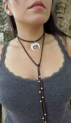 "Boho Wrap Necklace, Boho Choker Necklace, Native American Jewelry, Brown Turquoise Suede Necklace, Crescent Moon Necklace, Bohemian Jewelry ❤ BUY ANY 2 ITEMS ANS GET 15% OFF!! (USE COUPON CODE '15OFF') ❤ ❤ BUY ANY 4 ITEMS ANS GET 20% OFF!! (USE COUPON CODE '20OFF') ❤ ❤ BUY ANY 6 ITEMS AND GET 25% OFF!! ((USE COUPON CODE '25OFF') ❤ Complete any outfit with this unique gorgeous fashionable and trendy choker / wrap necklace. Made from 3x1.5mm suede leather cord, 33mm crescent moon charm and Turquo Bohemian Dangle Turquoise Necklace With Adjustable Fit, Bohemian Lariat Choker For Festivals, Bohemian Adjustable Choker With Moon Charm, Bohemian Jewelry With Moon Charm For Festivals, Hippie Brown Choker Jewelry, Hippie Style Brown Choker Jewelry, Adjustable Bohemian Necklace With Moon Charm, Bohemian Adjustable Necklace With Moon Charm, Bohemian Necklace With Moon Charm