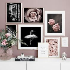 a white dresser topped with pictures and flowers next to a vase filled with pink roses