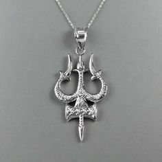 Sterling Silver Trident of Lord Shiva Trisula (Trishula) Pendant Necklace. Celebrate the divine energy and powerful symbolism of Lord Shiva with our Sterling Silver Trident of Lord Shiva Trisula Pendant Necklace. This meticulously crafted pendant features the iconic Trisula, representing Shiva's trident, which symbolizes creation, protection, and destruction. Made from high-quality sterling silver, this pendant exudes elegance and strength, making it perfect for daily wear or special occasions. Symbolic Jewelry For Rituals And Festivals, Symbolic Jewelry For Puja And Festivals, Symbolic Necklaces For Puja And Festivals, Symbolic Oxidized Jewelry For Festivals, Trishul Pendant For Men, Symbolic Sterling Silver Jewelry For Puja, Mahadev Pendant, Shiva Trident, Shiv Ji Pendant