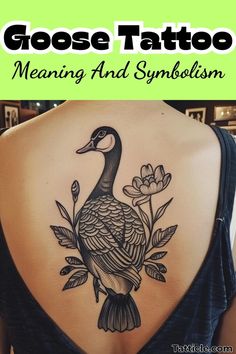 the back of a woman's shoulder with a goose tattoo on it and flowers