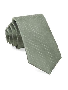 a green tie with white polka dots on the neck and bottom side, against a white background