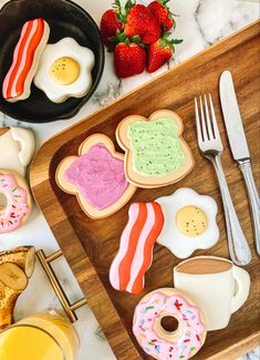 an assortment of breakfast foods on a cutting board