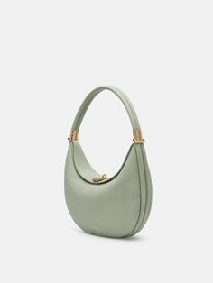 The Luna Bag is made of luxurious first layer cowhide leather. A beautiful curved shoulder bag that provides four different looks in one bag. Luna Bag, Oval Bag, Leather Suitcase, Crescent Shape, One Bag, Carolina Herrera, Matte Gold, Cow Leather, Fashion Games