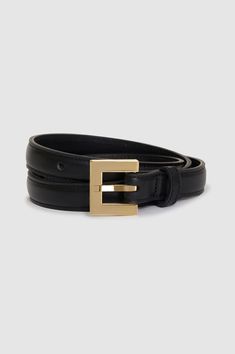 The Nicola Belt is crafted from black 100% cow leather with a slight sheen. This everyday style is slightly padded and features a custom square-shaped buckle in 14k gold-plated zinc engraved with subtle ANINE BING branding. Product Measurements: XS/S: Length: 30", Width: 0.8" M/L: Length: 34", Width: 0.8" 100% Cow Leather Spot clean Made in Turkey Elegant Black Rectangular Belt Buckle, Elegant Rectangular Belt Buckle For Workwear, Classic Belts With Gold Buckle, Classic Belts With Gold Rectangular Buckle, Elegant Formal Belt With Rectangular Buckle, Formal Belts With Gold Rectangular Buckle, Luxury Gold Belt For Office, Gold Belt With Rectangular Buckle For Business, Luxury Belt With Rectangular Buckle For Workwear